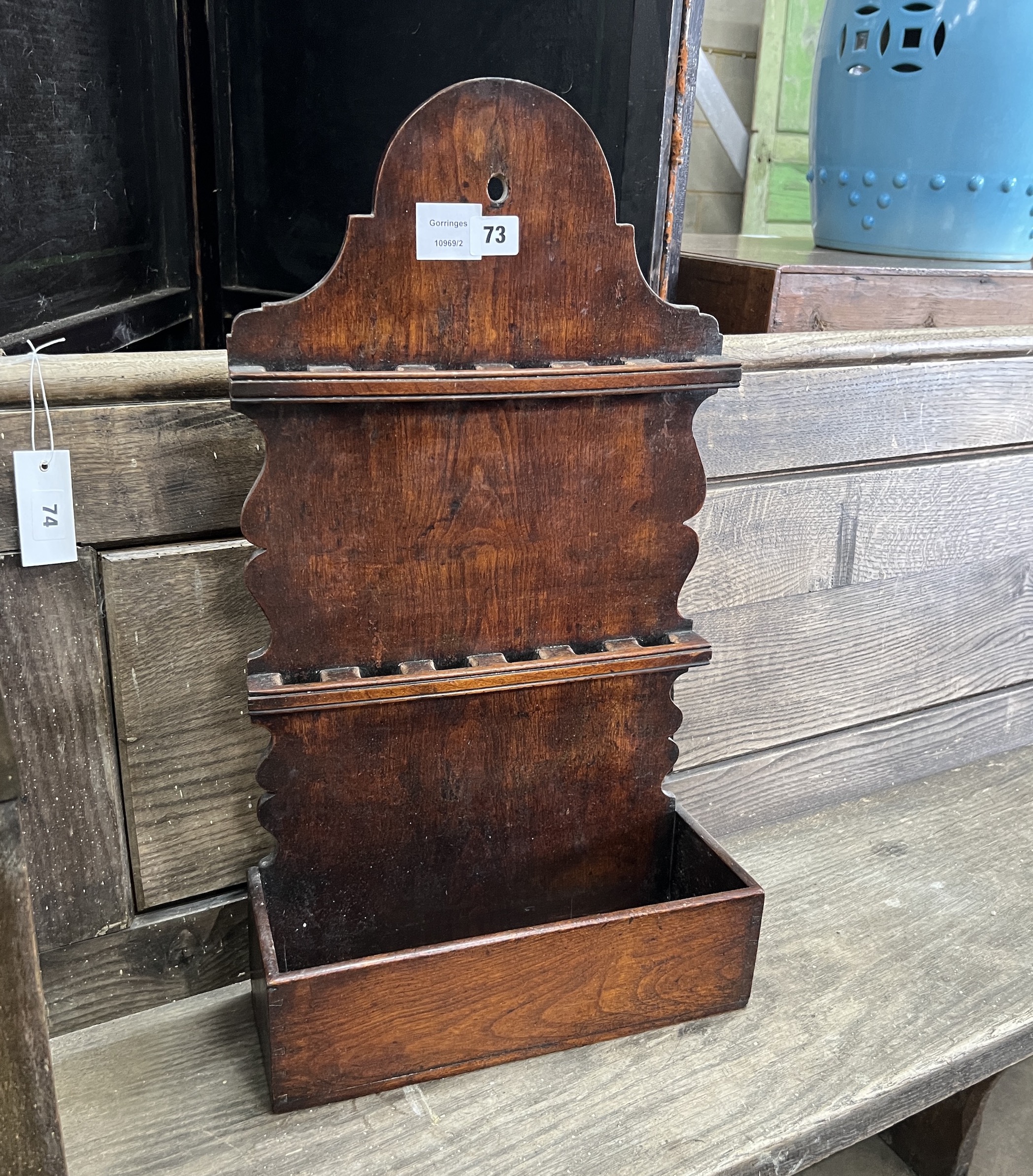 An 18th century oak spoon rack, width 35cm, depth 13cm, height 63cm